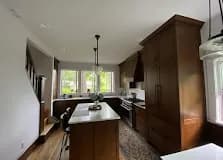 Walnut shaker with island and big windows