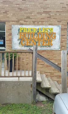 Real hand-painted PRICE-LESS BUILDING CENTER sign on the brick exterior