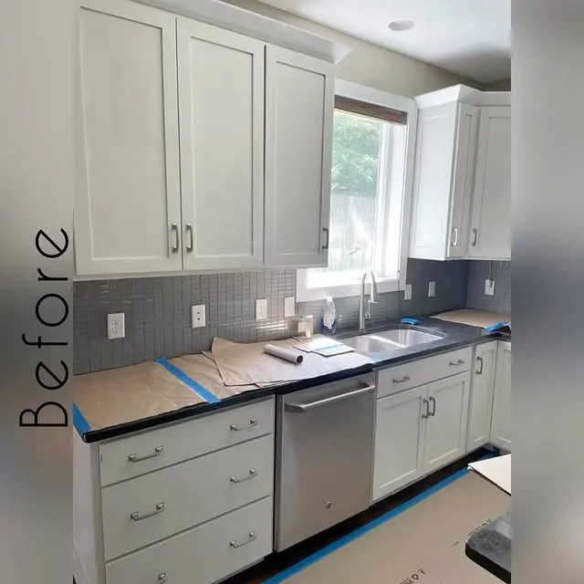 A real Four Squared install in progress. White shaker uppers, grey backsplash, kraft paper protecting the counters, blue painter's tape, clearly mid-renovation.