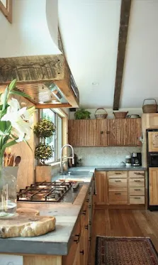 Rustic kitchen with exposed ceiling beam and reclaimed wood vent shroud.