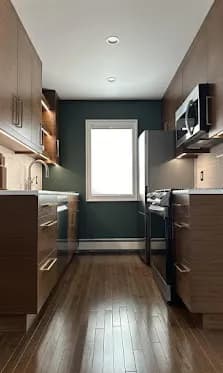 Galley two-tone: Light-wood lower cabinets with painted accents. Compact-kitchen friendly.