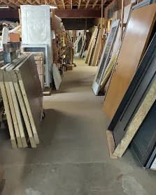 Real interior and exterior doors stacked on both sides. Real selection, real prices.